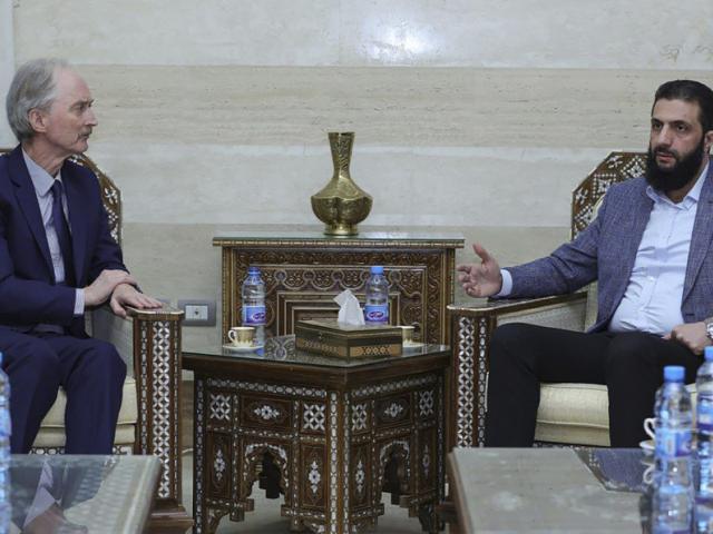 This photo shows the leader of Hayat Tahrir al-Sham Ahmad al-Sharaa, (Abu Mohammed al-Golani), right, as he meets with United Nations&#039; special envoy to Syria, Geir Pederson, in Damascus, Monday, Dec. 16, 2024. (SANA News Agency via AP)