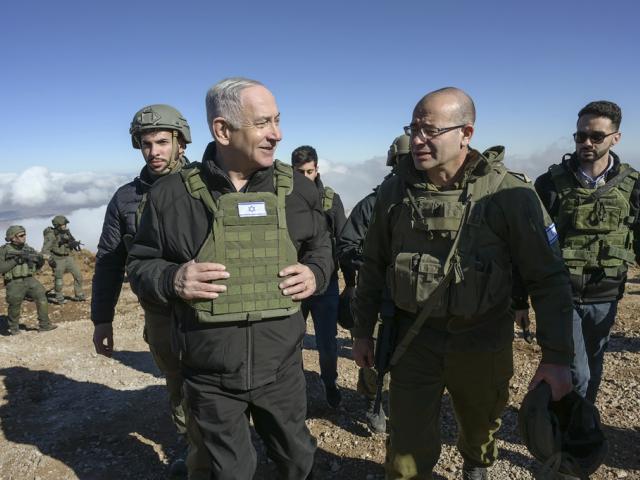 Israel&#039;s Prime Minister Benjamin Netanyahu, left, visits Israeli forces in a buffer zone inside Syria, Tuesday, Dec. 17, 2024. (Israel Government Press Office via AP)