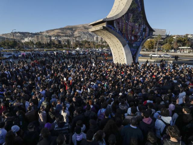 Syrian activists gather at the Umayyad square during a protest to demand a secular state, in Damascus, Syria, Thursday, Dec. 19, 2024. (AP Photo/Omar Sanadiki)