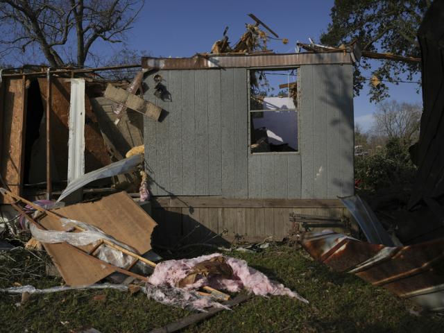 A mobile home sits damaged following a tornado that went through Katy, Texas, Saturday, Dec. 28, 2024. (Elizabeth Conley/Houston Chronicle via AP)