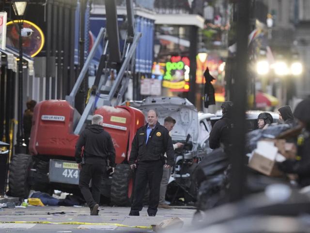 Emergency services attend the scene on Bourbon Street after a vehicle drove into a crowd on New Orleans&#039; Canal and Bourbon Street, Wednesday Jan. 1, 2025. (AP Photo/Gerald Herbert)