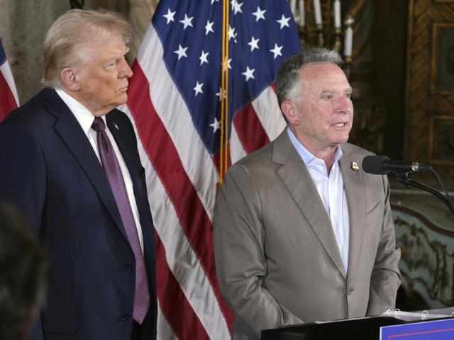  President-elect Donald Trump listens to Steve Witkoff speak during a news conference at Mar-a-Lago, Jan. 7, 2025, in Palm Beach, Fla. (AP Photo/Evan Vucci, File)