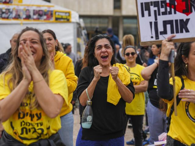 Relatives and friends of Israeli people killed and abducted by Hamas and taken into Gaza, react as they follow the news of the hostages&#039; release, in Tel Aviv, Israel, Saturday, Jan. 25, 2025. (AP Photo/Ariel Schalit)