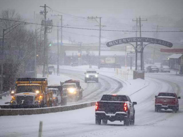 Snow plows make their way up the Granby Street bridge in Norfolk, Va. on Wednesday, Feb. 19, 2025. (Kendall Warner/The Virginian-Pilot via AP)