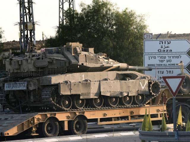 An Israeli Defense Forces tank is towed near the Israel-Gaza border, southern Israel, Thursday, June 26, 2025. (AP Photo/Maya Alleruzzo)