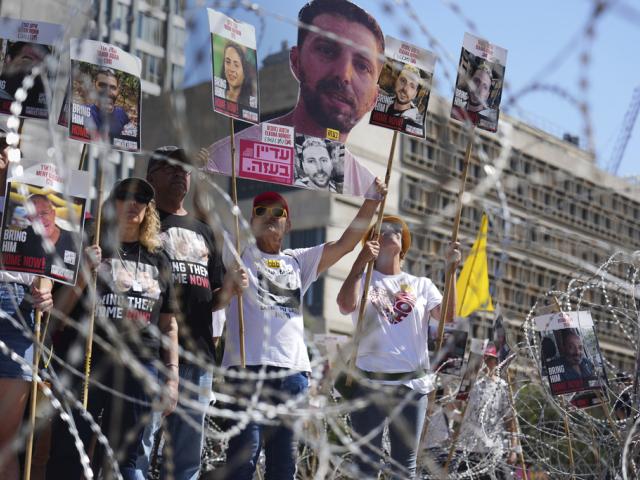 Families of hostages protest, demanding the release from Hamas captivity in the Gaza Strip, at the plaza known as the hostages square in Tel Aviv, Israel, Saturday, Aug. 2, 2025. (AP Photo/Ariel Schalit)
