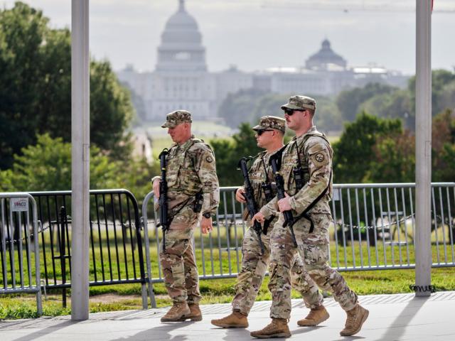 National Guard troops patrol the grounds of the Washington Monument with the Capitol in the distance as part of President Trump&#039;s order to impose federal law enforcement in the nation&#039;s capital, Aug. 28, 2025. (AP Photo/J. Scott Applewhite)