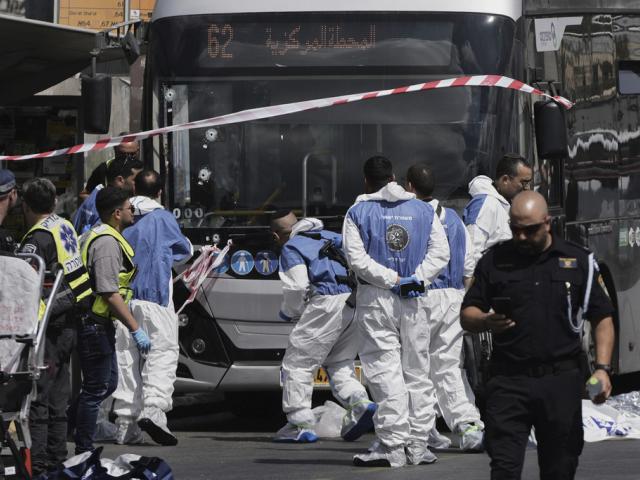 Israeli police and rescue teams respond at the scene of a shooting attack where several people killed and injured in Jerusalem, Monday, Sept. 8, 2025. (AP Photo/Mahmoud Illean)