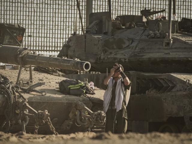  An Israeli soldier prays at a staging area on the border with Gaza Strip, as seen from southern Israel, Tuesday, Sept. 16, 2025. (AP Photo/Leo Correa)