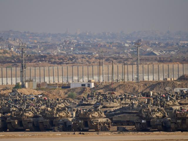 Israeli tanks are parked in a staging area near the border with Gaza, in southern Israel, Tuesday, Nov. 18, 2025. (AP Photo/Ohad Zwigenberg)