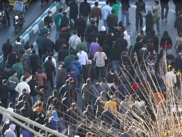 Protesters march in downtown Tehran, Iran, Monday, Dec. 29, 2025. (Fars News Agency via AP)