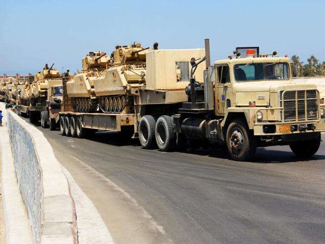 Army trucks carry Egyptian military tanks in El Arish, Egypt&#039;s northern Sinai Peninsula, Thursday, Aug. 9, 2012. (AP Photo, File)