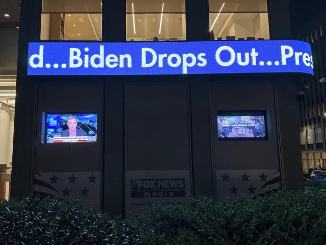 A headline on the news ticker at Fox News headquarters in New York announces &quot;Biden Drops Out&quot; on Sunday, July 21, 2024. (AP Photo/Ted Shaffrey)
