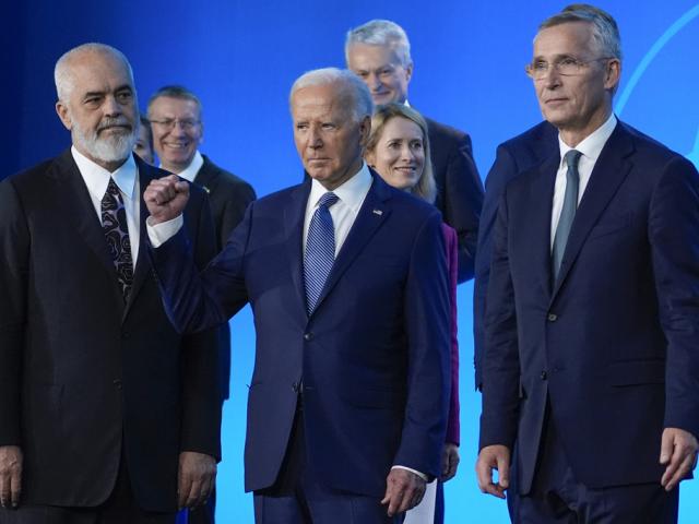 President Joe Biden gestures after a family photo at the NATO Summit, July 10, 2024, in Washington. (AP Photo/Evan Vucci)