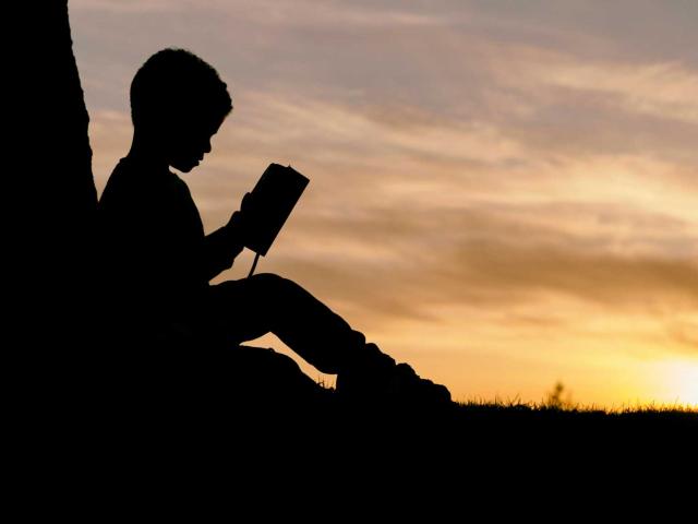 Child Reading a Bible