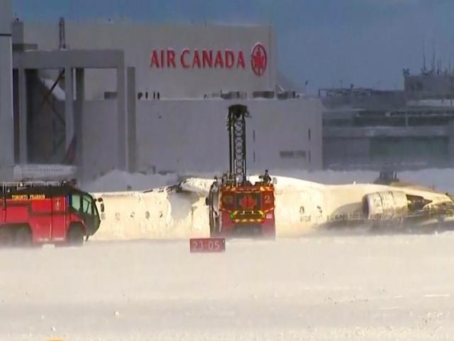 This image taken from video provided by CTV shows emergency crews responding at Toronto Pearson Airport after a plane crash, Monday, Feb. 17, 2025. (CTV via AP)