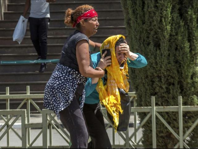 Family members of the victims involved in a plane crash react at Addis Ababa international airport Sunday, March 10, 2019. (AP Photo/Mulugeta Ayene)