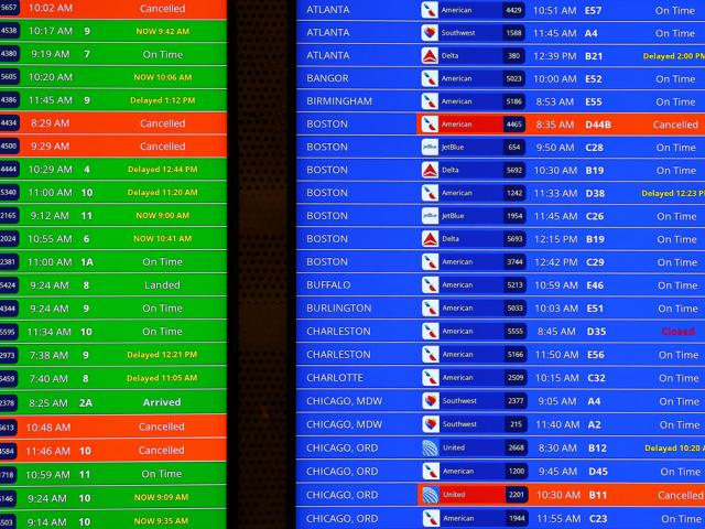 A departure board with multiple cancelled and delay notices on a flight video board at Ronald Reagan Washington National Airport, Monday, Nov. 10, 2025, in Arlington, Va. (Aaron M. Sprecher via AP)