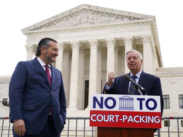 Sen. Lindsey Graham, (R-SC), right, speaks as Sen. Ted Cruz (R-TX), left, listens during a news conference outside the Supreme Court in Washington, Thursday, April 22, 2021. (AP Photo/Susan Walsh) grahamcourt
