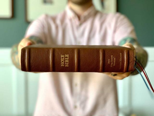 Man Holding Bible