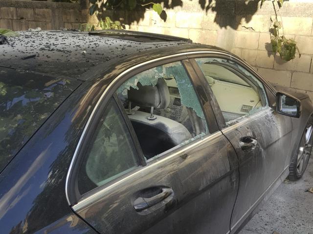 A damaged car after what is believed to be the result of a walkie-talkie exploding inside it, in the city of Sidon, Lebanon, Sept. 18, 2024. (AP Photo/Mohammed Zaatari)