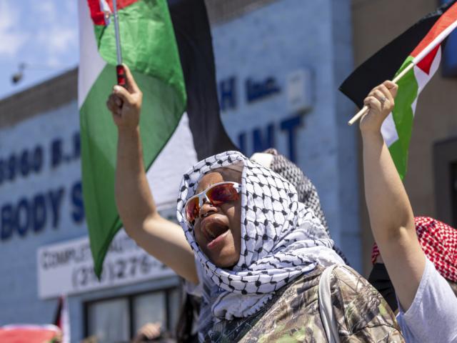 A Pro-Palestinian protester shouts outside Adas Torah synagogue June 23, 2024 in Los Angeles. (Zoe Cranfill / Los Angeles Times via AP)