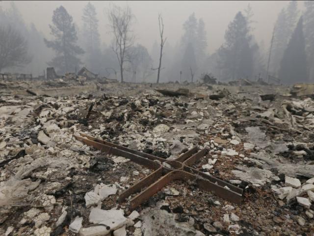 A cross is among the rubble of the Our Savior Lutheran Church Friday, Nov. 9, 2018, in Paradise, Calif. The church was destroyed by a wildfire that swept through the area. (AP Photo)