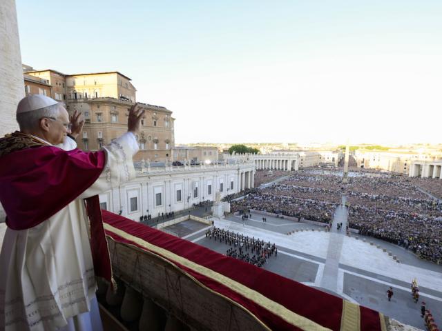 Newly elected Pope Leo XIV waves to faithful and pilgrims gathered in St. Peter&#039;s Square shortly after his election, Thursday, May 8, 2025. (Vatican Media via AP)