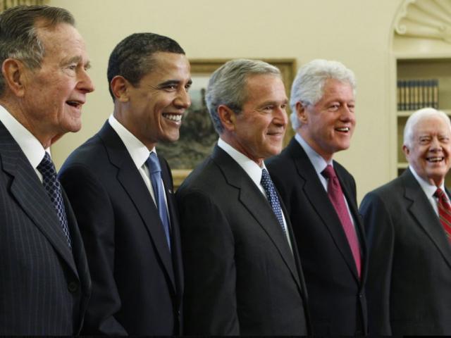 In this Jan. 7, 2009, file photo, President George W. Bush, center, poses with President-elect Barack Obama, second left, and former presidents, George H.W. Bush, left, Bill Clinton, second right, and Jimmy Carter, right. AP photo.