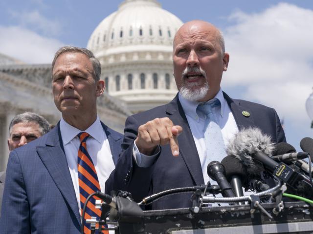 Rep. Scott Perry (R-PA) left, and Rep. Chip Roy (R-TX) rally the House Freedom Caucus against the debt limit deal, May 30, 2023, on Capitol Hill. (AP Photo/Jacquelyn Martin)
