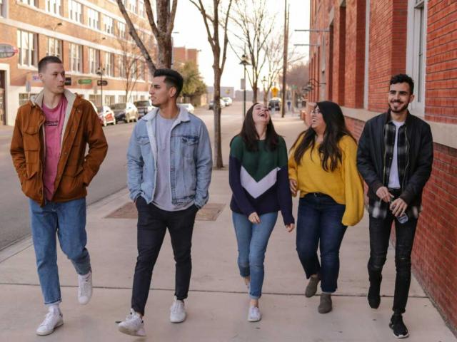 Teens walking down street