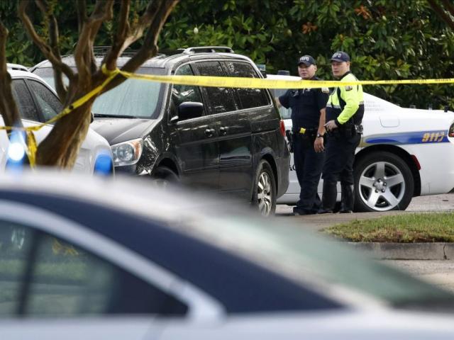 Law enforcement officials work outside a municipal building that was the scene of a shooting, Saturday, June 1, 2019, in Virginia Beach, Va.  (AP Photo/Patrick Semansky)