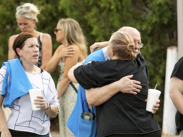 Walmart employees and customers after a stabbing incident in Traverse City, Mich., July 26, 2025. (Jan-Michael Stump/Traverse City Record-Eagle via AP)