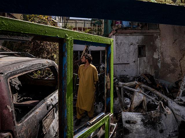 An Afghan inspects the damage of Ahmadi family house in Kabul, Afghanistan, Monday, Sept. 13, 2021. (AP Photo/Bernat Armangue)