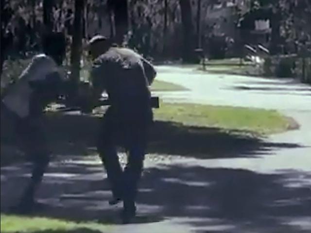 This image from video posted on Twitter May 5, 2020, purports to show Ahmaud Arbery, struggling with Travis McMichael over a shotgun in a neighborhood outside Brunswick, Ga., on Feb. 23, 2020. The AP has not been able to verify the source of the video. 