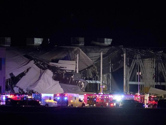 An Amazon distribution center is heavily damaged after a strong thunderstorm moved through the area Friday, Dec. 10, 2021, in Edwardsville, Ill. (AP Photo/Jeff Roberson)