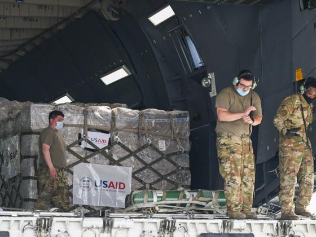 Relief supplies from the United States in the wake of India&#039;s COVID-19 situation arrive at the Indira Gandhi International Airport cargo terminal in New Delhi, India, Friday, April 30, 2021. (Prakash Singh/Pool via AP)
