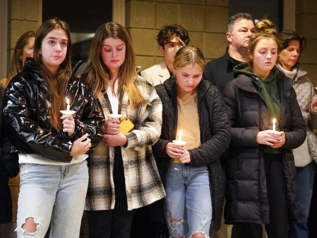 Students attend a vigil at LakePoint Community Church in Oxford, Mich., Tuesday, Nov. 30, 2021. (AP Photo/Paul Sancya)