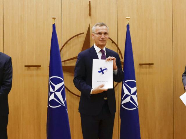 Finland&#039;s Ambassador to NATO Klaus Korhonen, NATO Secretary-General Jens Stoltenberg and Sweden&#039;s Ambassador to NATO Axel Wernhoff attend a ceremony to mark Sweden&#039;s and Finland&#039;s application for membership. (AP Photo)a