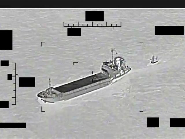 This photo released by the U.S. Navy shows the Iranian Revolutionary Guard ship Shahid Bazair, left, towing a U.S. Navy Saildrone Explorer in the Persian Gulf on Tuesday, Aug. 30, 2022.  (U.S. Navy via AP)
