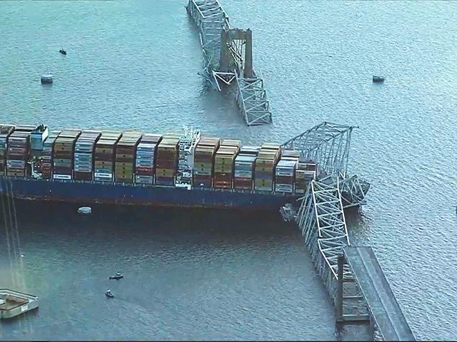 A container ship collided with the Francis Scott Key Bridge Tuesday, March 26, 2024 in Baltimore. The major bridge in Baltimore snapped and collapsed and several vehicles fell into the river below. (WJLA via AP)
