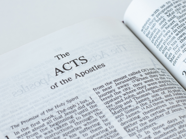 Open Bible showing the Book of Acts