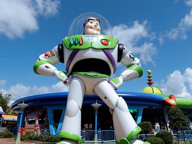 Buzz Lightyear stand near the entrance to the Alien Swirling Saucers ride at Toy Story Land in Disney&#039;s Hollywood Studios at Walt Disney World in Lake Buena Vista, Fla. (AP Photo/John Raoux)