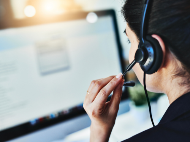 call center woman wearing a headset and talking