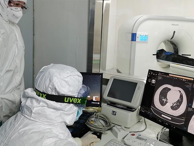 Doctors in China scan a patient&#039;s lungs at Huoshenshan temporary hospital built for patients diagnosed with coronavirus in Wuhan in central China&#039;s Hubei province (Gao Xiang/Xinhua via AP)
