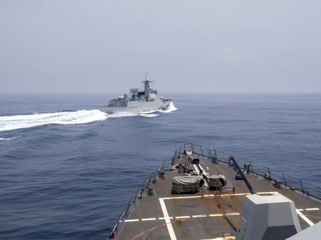 A Chinese navy ship cuts sharply across the path of the American destroyer USS Chung-Hoon, forcing the U.S. ship to slow to avoid a collision. (Photo: Mass Communication Specialist 1st Class Andre T. Richard/U.S. Navy via AP)