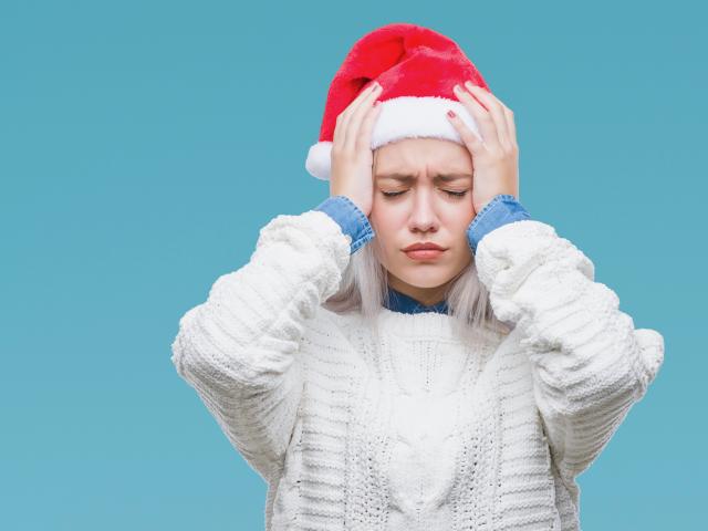 Frustrated woman in Santa hat