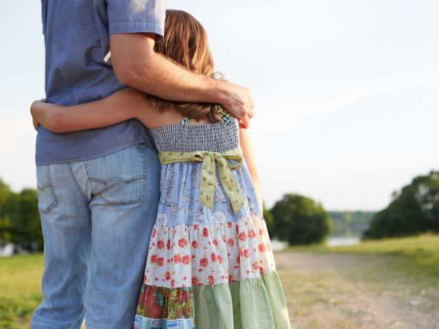 dad daughter side hug