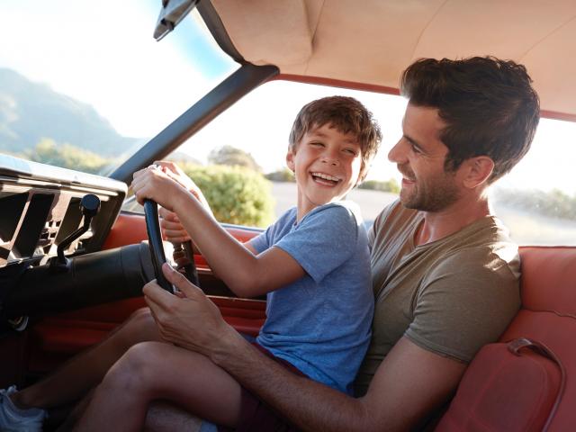 Dad fake driving with young son