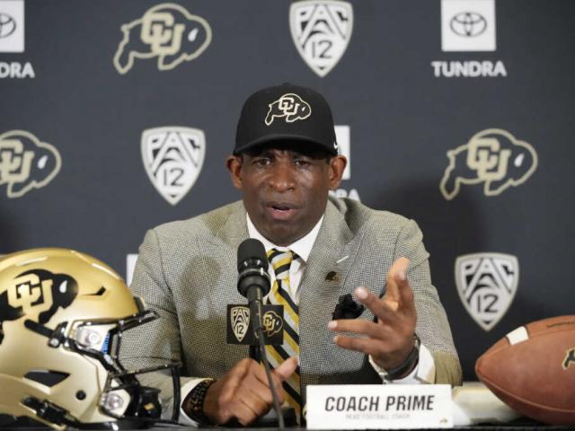 Deion Sanders speaks after being introduced as the new head football coach at the University of Colorado during a news conference Sunday, Dec. 4, 2022, in Boulder, CO (AP Photo/David Zalubowski)